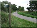 Footpath Sign And Country Road in CB8 8YB