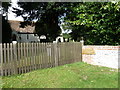 Fence outside St James, Woodmancott in SO21 3BN