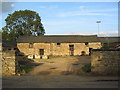 Old farm buildings on south edge of Gretton in NN17 3GD