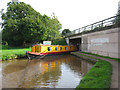 Narrowboat passes the A53 bridge, north east of Market Drayton in TF9 1HS
