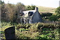Derelict cottage at Bridgend on the A941. in AB54 4EH
