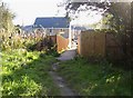 Footpath into new housing estate, Birkhouse, Clifton in HD6 4JN