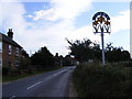 B1084 Woodbridge Road & Butley Village sign in IP12 3PW