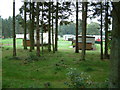 The Gart caravan park through the trees in FK17 8LE
