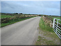 Lane back to Neuadd and the A5025 in Llanbadrig Community