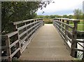 Footbridge over river channel and weir by Thurmaston Lock in LE4 8AF