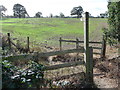 Finger post and stile on a footpath near Gains Park, Shrewsbury in SY3 8DB