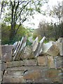 Dry stone wall at edge of Coed Nercwys in CH7 4AY