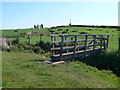 Large footbridge over a small stream in LL18 2PB