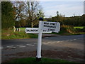Signpost at road junction just a short distance from the A271 in TN33 9NS