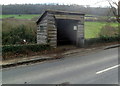 Wooden bus shelter south of Slad in GL6 7JZ
