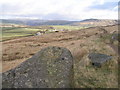 Rock with rivet benchmark beside the Pennine Bridleway in OL14 6JJ