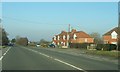 Houses by A38 near Swanley Lane in GL13 9JL