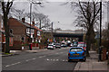 A cluttered Urmston Lane with the M60 bridge ahead in M41 9LD