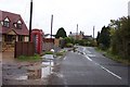 Village street with Red Phone Box, Wiggenhall St Mary Magdalen in PE34 3BX