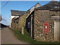 Farm buildings at the crossroads at Longlands in PL12 4QQ