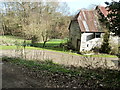Old barn by Hole Cottage in GU8 6NN