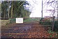 Gate into The Abbey Estate just off the A429 in GL7 5HA