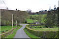 Downhill on the Heath House Lane towards Hollington Road and Lodge for Heath House in ST10 4SB