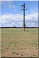 Power lines crossing a field near Tumpy Green in GL11 5HZ