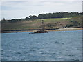 Crow Rock with St Marys in the background in Isles of Scilly