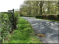 Footpath sign opposite the entrance to The Combe in GU31 5DP