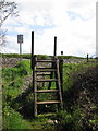 Steps over the fence as the footpath crosses the railway in MK7 8RE