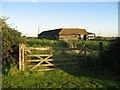 A Wooden Gate And Barn in IP25 7BZ