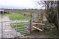Stile and footpath into orchards near Sissinghurst in TN17 2AH