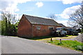 Red brick farm building on Thurvaston Road in Marston Montgomery