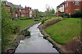 Brook flowing through a new housing estate in MK19 6HY