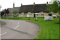 Yardley Gobion green and thatched cottages in NN12 7TX