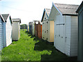 Beach huts in meadow, Old Felixstowe in IP11 9PS