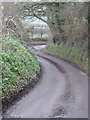 Winding Woodcutts Lane in BH21 7HA