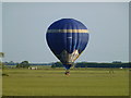 Hot air balloon flying very low near Westry, March in Fenland District