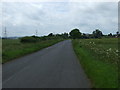 Minor road heading south towards the A47 in PE6 7BG