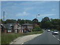 Bus stop and houses at Efford Bridge in SO41 8DA