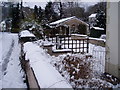 Cymau Road in the snow in LL11 5LL