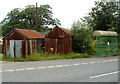 Two rusty corrugated buildings and a bus shelter, Sennybridge in LD3 8TR