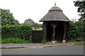 Thatched shelter for the old village pump in Old Warden