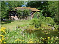 The pond and oast at Beech Court Gardens in TN25 4DL
