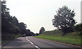A458 passing woods by Whiston Priory in SY5 9NJ