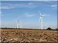 Ploughland and wind farm in CB21 4EU