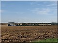Ploughed field and Grange Farm in CB21 4EU