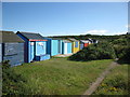 Colourful beach huts in IV30 5TN