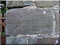 Engraved stone in Church gatehouse wall of St. Tyssilio's church in Llandissilio West Community