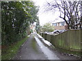 Drive behind houses on Ashurst Road in RH19 3UF