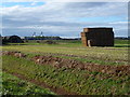 Straw stack at Halfpenny Toll House Farm in PE6 7YX