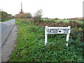 Sign to Chestnut Farm on Old Common Road in KT11 1DF