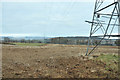 Pylons crossing farmland near West Mains in DD8 1TT